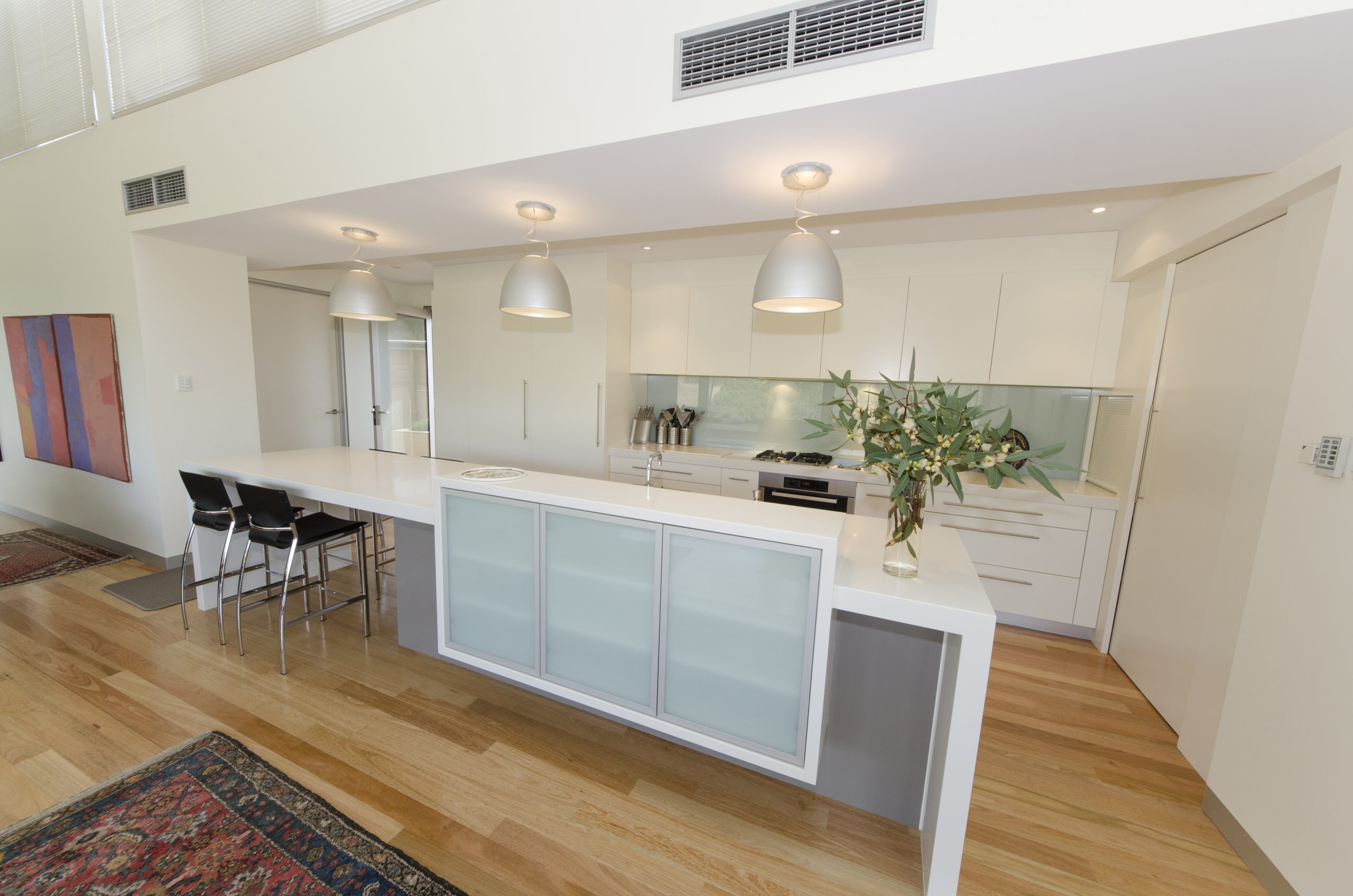 A minimalist kitchen design featuring an island counter - designed by Goolwa Kitchen