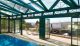 An outdoor pool and enclosure by Sunwise Pools