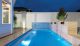 A simple outdoor pool by Liquid Blue Pool & Spa Design