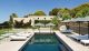 A contemporary restort-style pool by Aquarius Swimming Pools