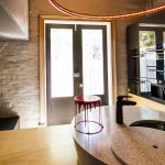 This kitchen certainly doesn't follow the crowd - the design is unique and edgy