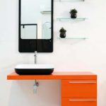 A black and orange modern bathroom from Easy Bathroom Solutions.