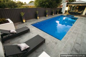 outdoor pool design with lounge chairs
