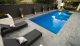 outdoor pool design with lounge chairs