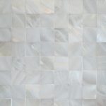 Gorgeous white bathroom with pearl tiles