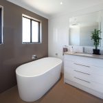 Gorgeous white bathroom with pearl tiles
