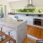 attards kitchen gloss white with granite surfaces, stainless steel appliances and timber floors