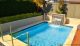 jakin pool with landscaping and water feature