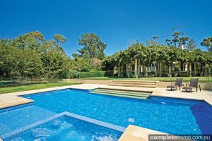 landscaped pool with tropical design features