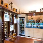 This bar and second kitchen by Enigma Interiors is both vibrant and elegant — and an interesting design idea.