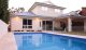 This modern pool and home design is clean and seamless