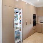 Functional kitchen with hidden laundry