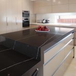 Functional kitchen with hidden laundry