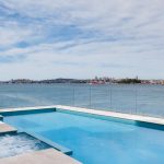 Frameless glass fencing creates the perfect effect for this harbourside pool