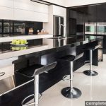 With a dramatic two-tone scheme, this high gloss kitchen is the definition of glamorous