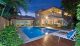 Expertly finished and landscaped, this pool is made for stylish entertaining