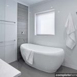 This fresh and inviting bathroom was designed to suit a growing family, so an open space with functional elements was a must