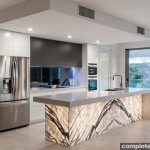 With dramatic marble and mute cabinetry tones, this kitchen has both interesting focal points and unique features