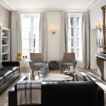 The combination of leather lounges and upholstered chairs ties luxe with contemporary pieces