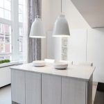 Hanging pendants are functional and beautiful to look at in a minimalist and classic kitchen