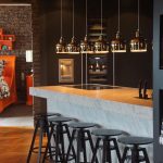 Expert tip: Hanging gold pendants add modern glamour  to a busy space