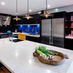 A kitchen with butcher’s block, deep fryer and chargrill plate