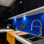 A kitchen with butcher’s block, deep fryer and chargrill plate