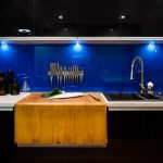 A kitchen with butcher’s block, deep fryer and chargrill plate