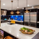 A kitchen with butcher’s block, deep fryer and chargrill plate