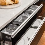 A kitchen with butcher’s block, deep fryer and chargrill plate