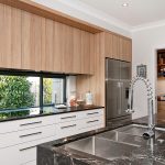 A simple modern kitchen with black marble sink