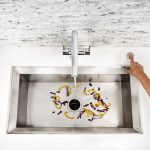 A view of a simple sink and food scraps in it