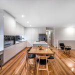 The large island bench enables the kitchen to function as a cooking, dining and work space