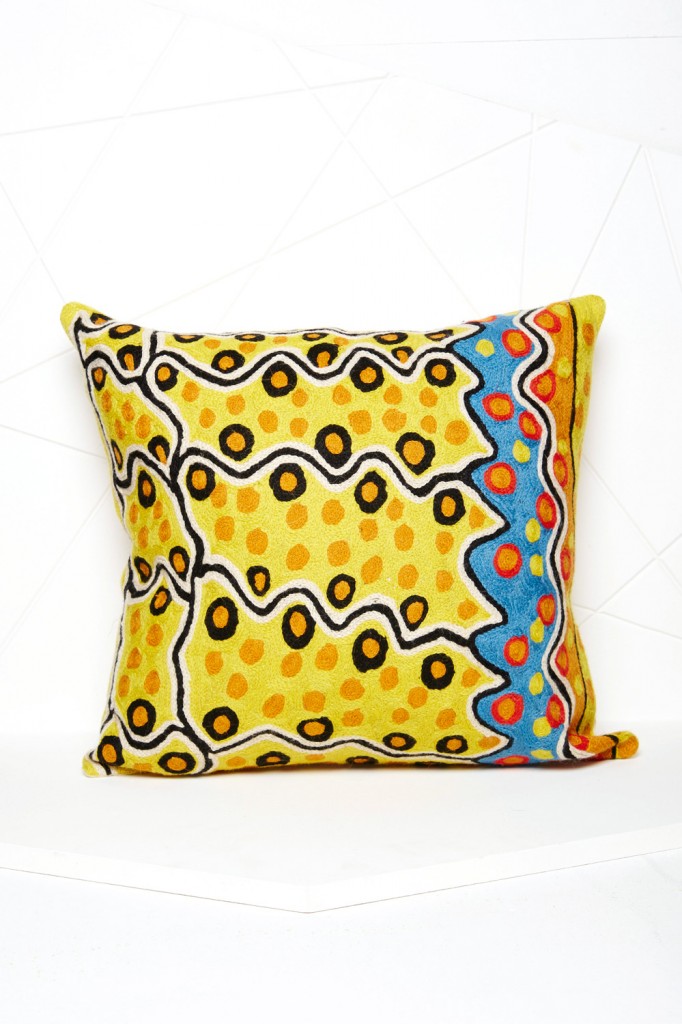 The Better Worlds art cushion by Rama Sampson is chain stitched onto a cotton base using traditional Kashmiri handicraft, while the wool is custom dyed to match the artist’s original image. koskela.com.au