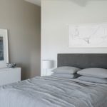 A linen bedhead adds texture to the space