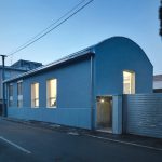 The exterior of the home alludes to its industrial past