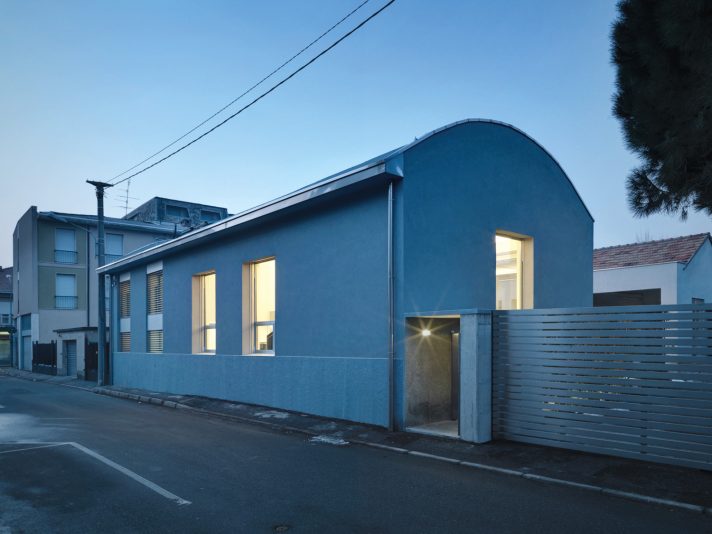 The exterior of the home alludes to its industrial past
