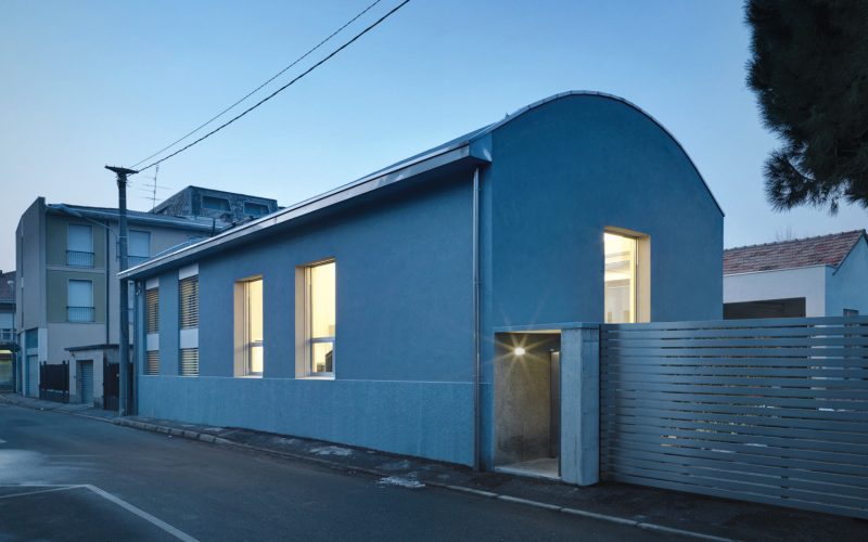 The exterior of the home alludes to its industrial past