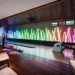 A bowling alley on the play level is decked out with the latest technology