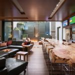 A timber benchtop adds a natural element to the bar