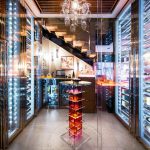A wine cellar is illuminated to the max with lights
