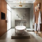 A luxe bathroom features a freestanding tub to soak the day away