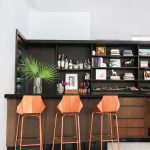 Copper stools add glamour to the neutral space