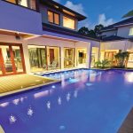 This stylish, modern pool features an amazing vertical raindrop water feature