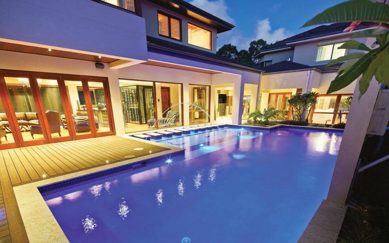 This stylish, modern pool features an amazing vertical raindrop water feature