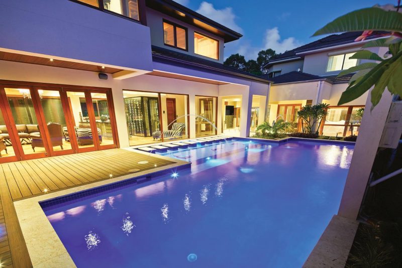 This stylish, modern pool features an amazing vertical raindrop water feature