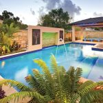 This stylish, modern pool features an amazing vertical raindrop water feature