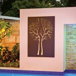 This stylish, modern pool features an amazing vertical raindrop water feature