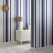 Expand a small space or create the illusion of high ceilings with the Hoppen Stripe wallpaper in white and Prussian blue from GRAHAM & BROWN. The white stripes are textured with a linen effect while a subtle silver strip lines either side, making it pop. grahambrown.com/uk