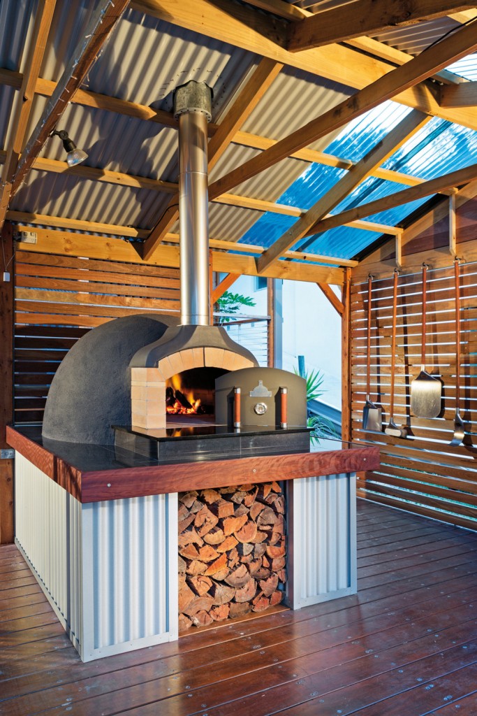An oven from The Melbourne Fire Brick Company is the focal point of this outdoor kitchen.